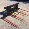 A pallet with red forks on it