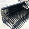 A black metal bench with a bunch of metal bars on it