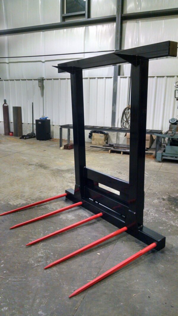 A fork lift with forks attached to it.