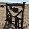 Heavy-duty metal frame attachment on dry farmland.