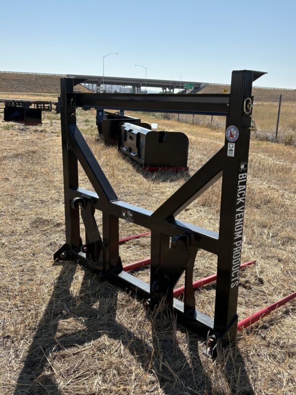 Heavy-duty metal frame attachment on dry farmland.