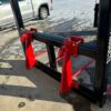Red forklift attachment on a forklift.