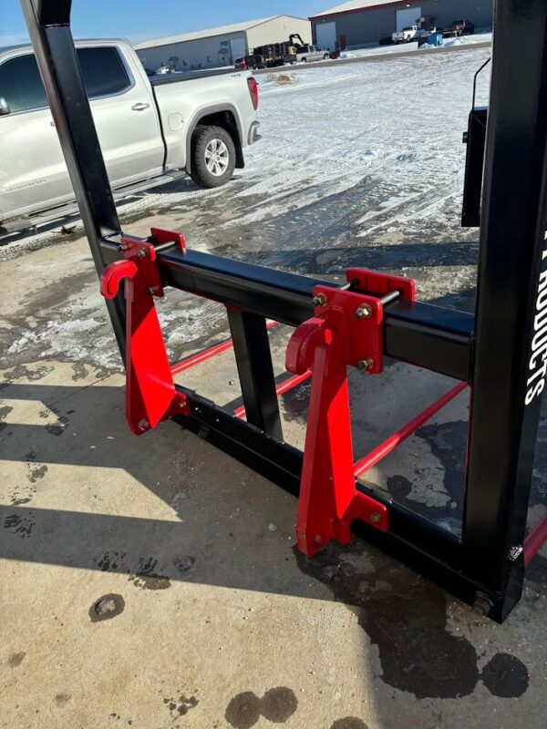 Red forklift attachment on a forklift.
